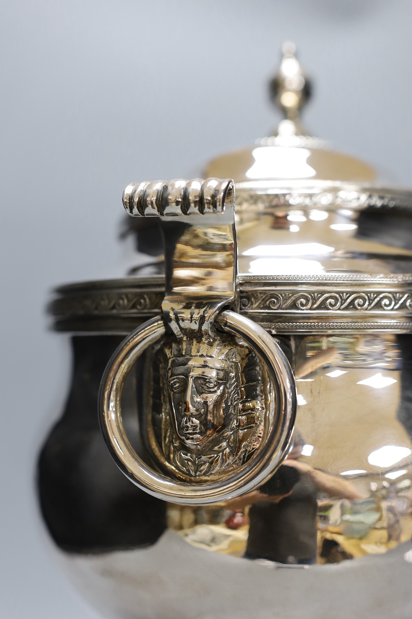 A 19th century silver plated tea urn, Egyptianesque handles, 43cm
